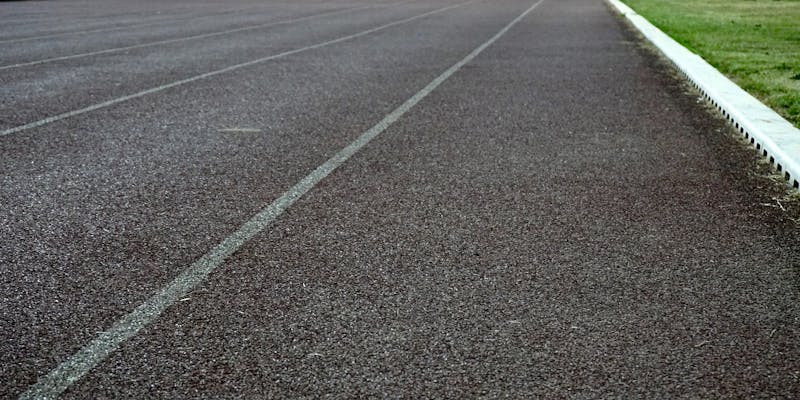 Athletes running on track